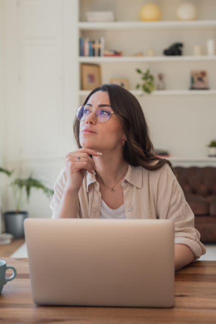 Coach or consultant at laptop wondering why their expertise isn't visible in Google and AI search